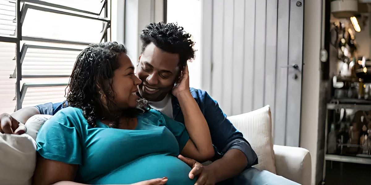 Happy couple embracing at home