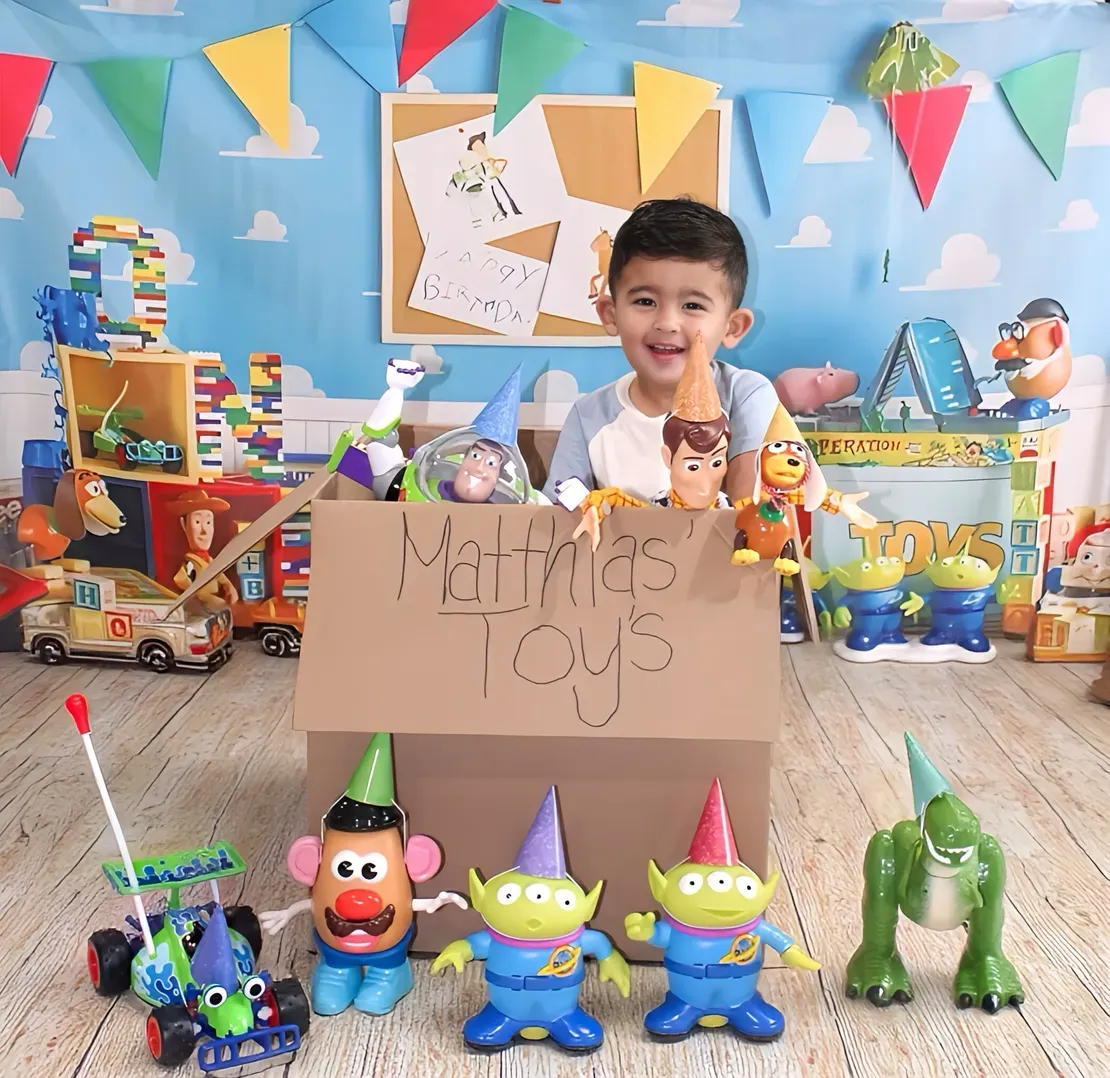 Child surrounded by colorful toy collection