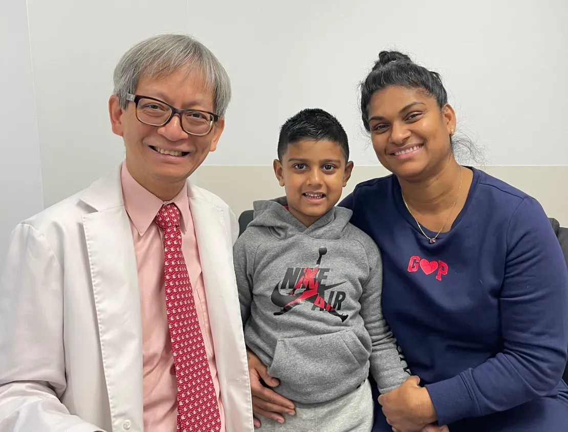 Doctor with family smiling in clinic