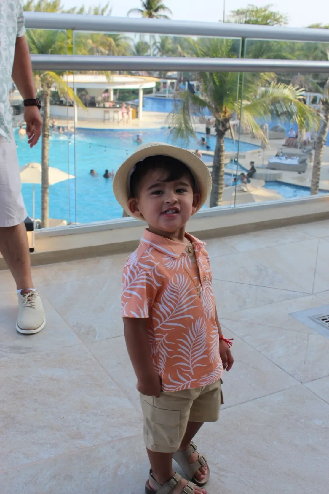 Kid in orange shirt at resort