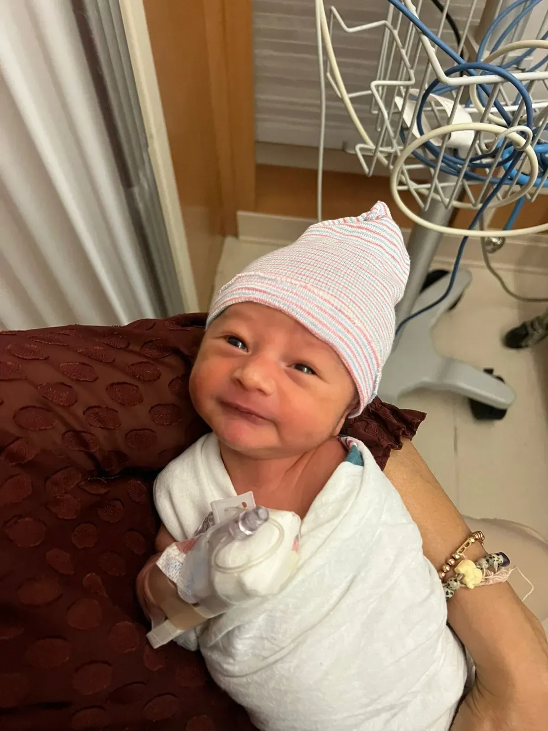 Newborn baby wrapped in white blanket