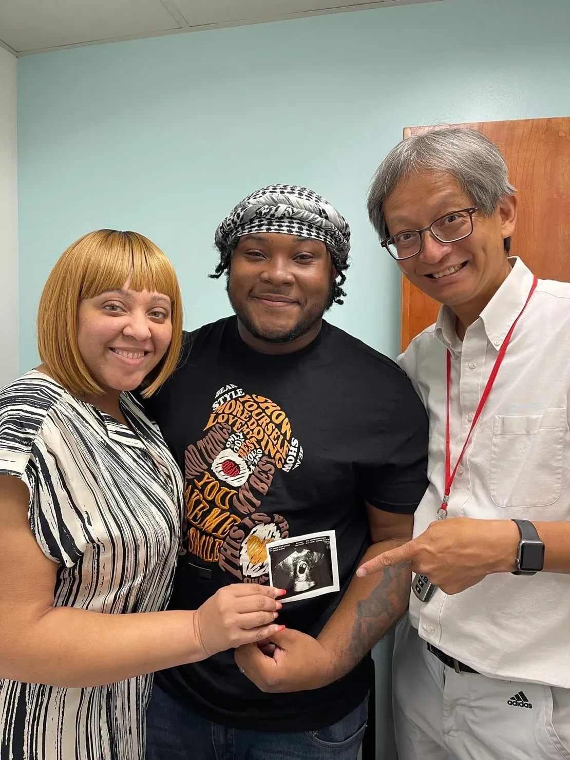 Happy trio with baby scan
