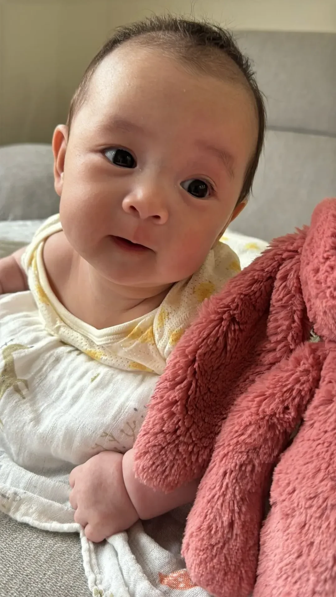 Infant gazing curiously at the camera
