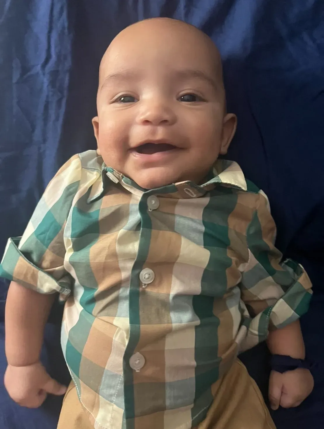 Happy baby on blue background